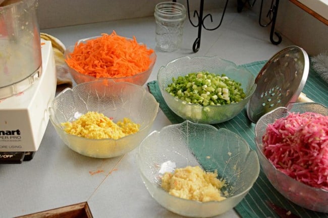 Different glass bowls of ingredients for kimchi style sauerkraut. | MakeSauerkraut.com